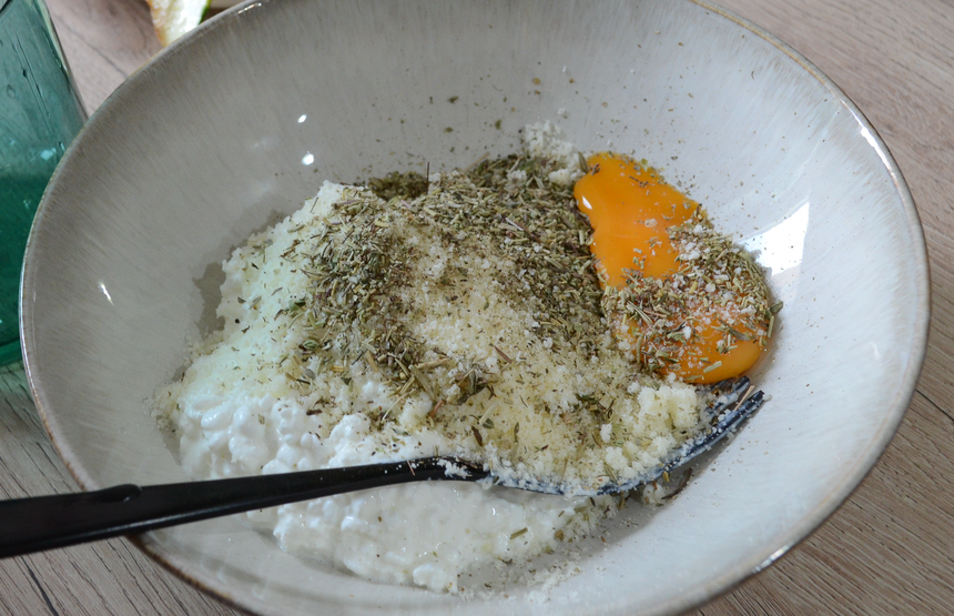 Egg, spices, cheese in a bowl