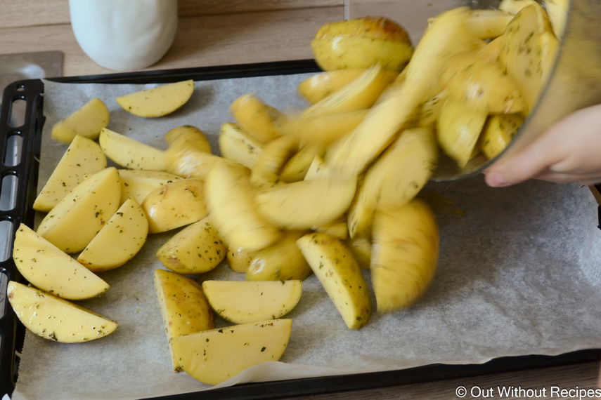 Placing potatoes on a sheet